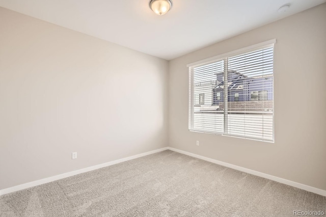 unfurnished room with carpet flooring