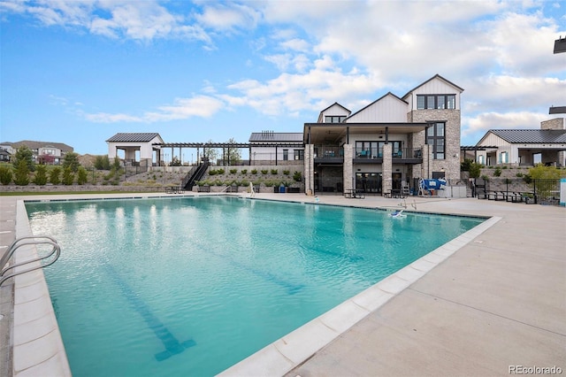 view of swimming pool featuring a patio area