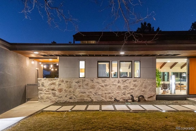 view of back of house at twilight