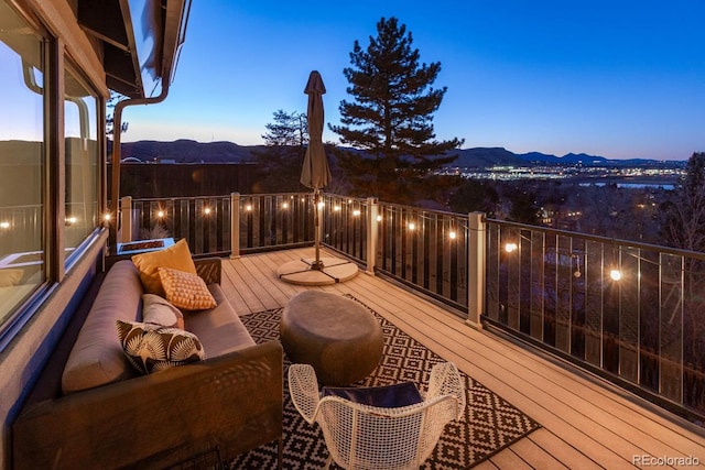 wooden terrace featuring a mountain view