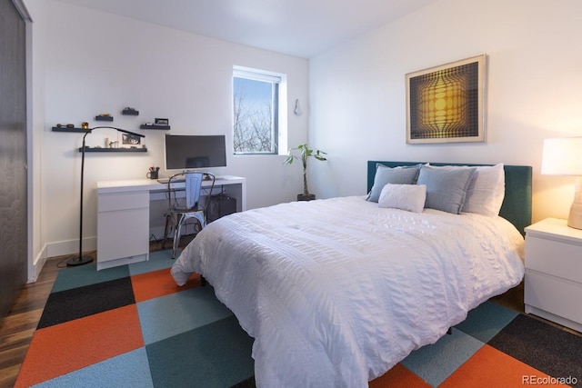 bedroom featuring wood finished floors