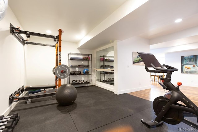 exercise room featuring recessed lighting and baseboards