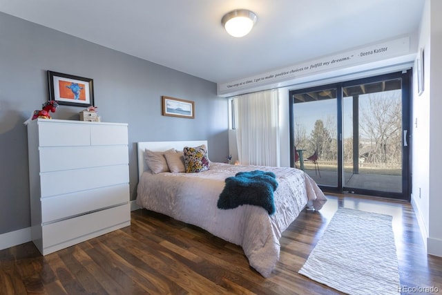 bedroom featuring access to exterior and wood finished floors