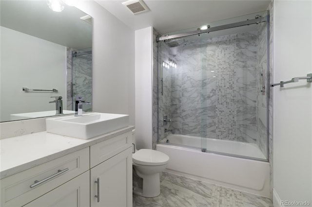 full bathroom featuring toilet, enclosed tub / shower combo, and vanity