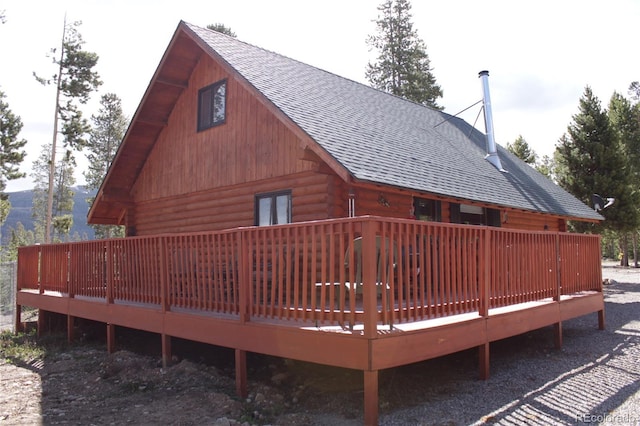36 Hilltop Dr, Walden, CO 80480 - back of property with a shingled roof, log exterior, and a wooden deck