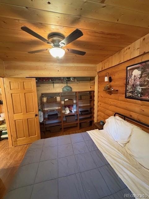 36 Hilltop Dr, Walden, CO 80480 - bedroom featuring wood ceiling, log walls, and wood finished floors