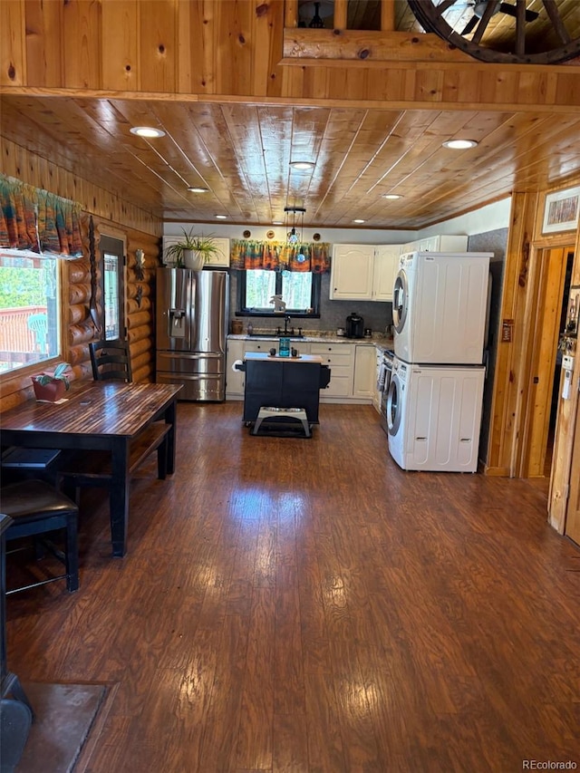 36 Hilltop Dr, Walden, CO 80480 - recreation room with stacked washer / dryer, wood ceiling, and dark wood-style flooring