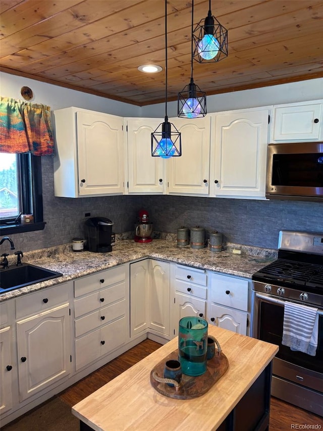 36 Hilltop Dr, Walden, CO 80480 - kitchen with appliances with stainless steel finishes, wood ceiling, a sink, wooden counters, and white cabinetry
