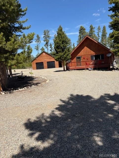36 Hilltop Dr, Walden, CO 80480 - view of yard with a deck, an outbuilding, and a detached garage