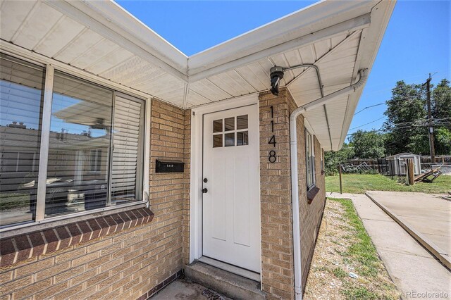 1148 Rosemary St, Denver, CO 80220 - property entrance featuring brick siding