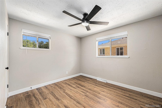 1148 Rosemary St, Denver, CO 80220 - unfurnished room featuring wood finished floors, ceiling fan, and a textured ceiling