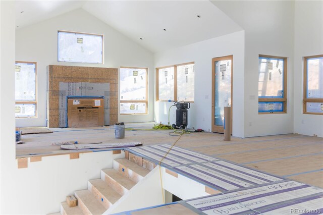 2035 Highlands Dr, Breckenridge, CO 80424 - stairway with high vaulted ceiling, plenty of natural light, and wood finished floors
