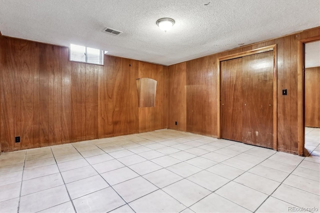 4940-42 W 9th Ave W, Denver, CO 80204 - unfurnished room with wood walls and a textured ceiling