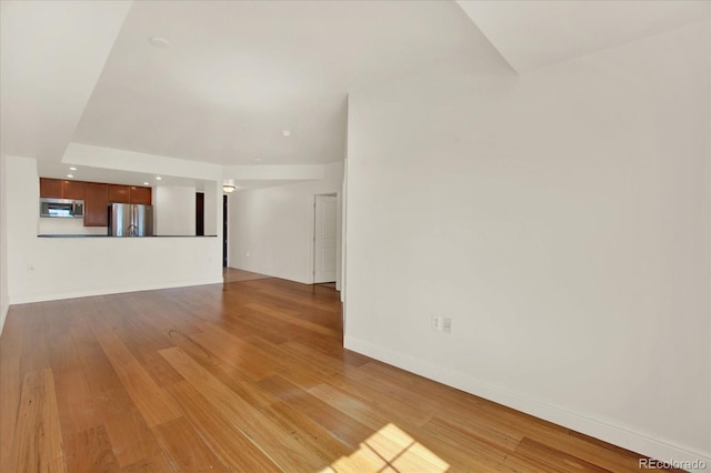 unfurnished living room featuring light hardwood / wood-style floors