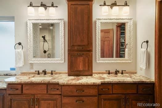 bathroom featuring double vanity and a sink