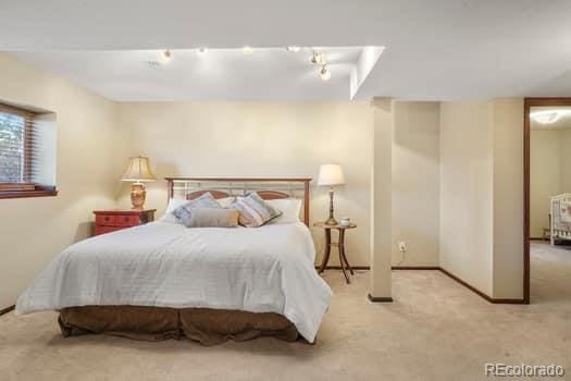 carpeted bedroom with baseboards