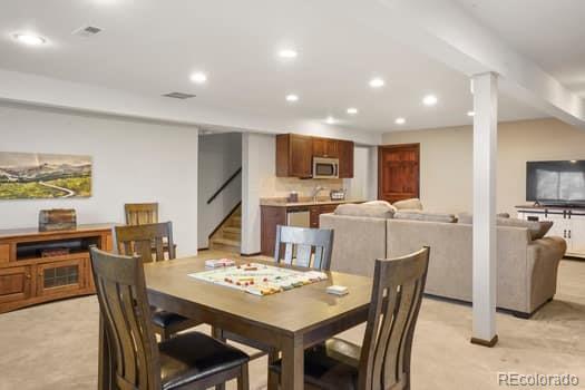 dining area featuring stairs and recessed lighting