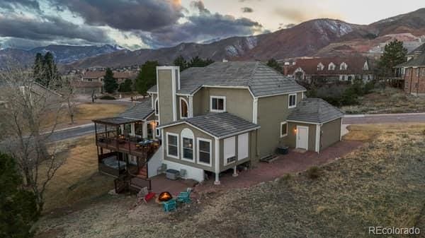 rear view of house with a mountain view