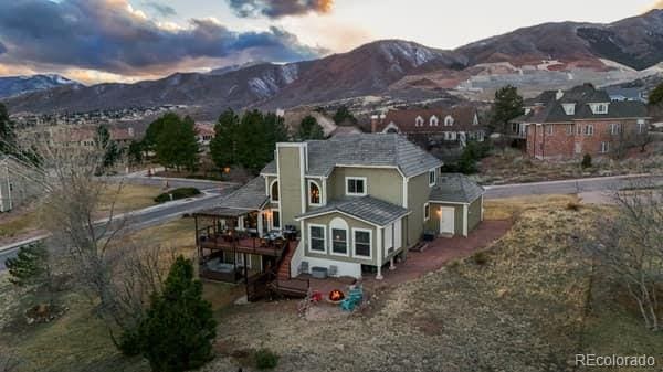 back of property featuring a mountain view