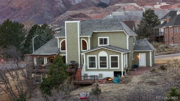 view of front of house with a deck with mountain view