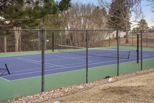 view of sport court with fence