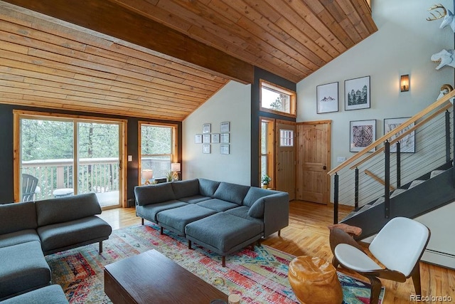 living room with wooden ceiling, stairway, wood finished floors, and high vaulted ceiling