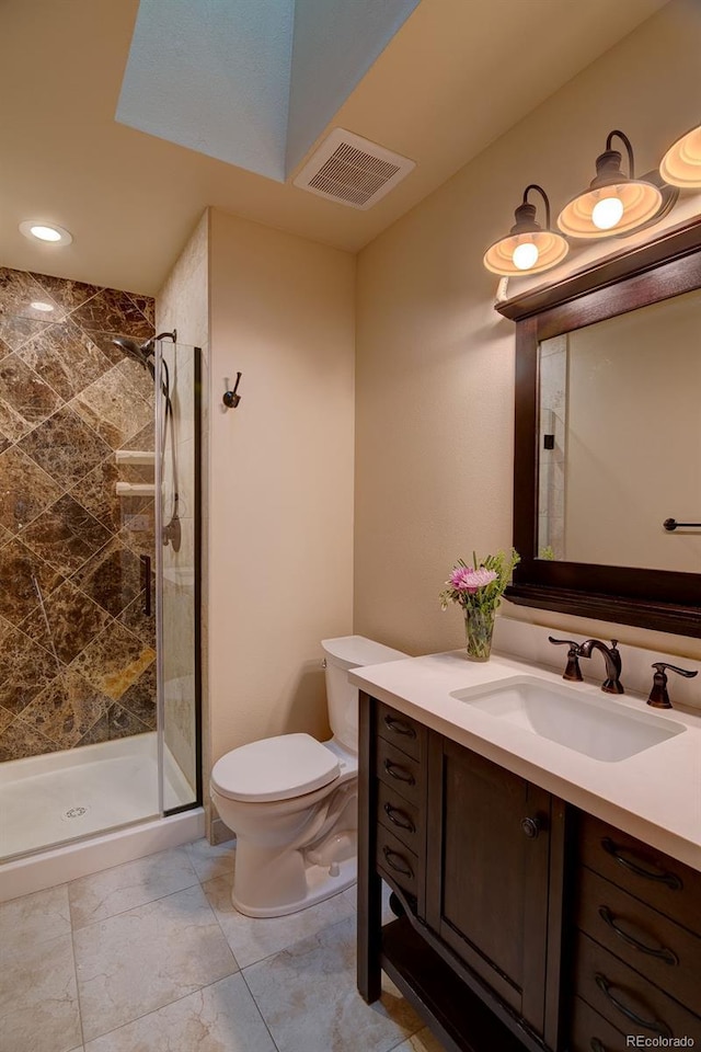 full bathroom featuring a stall shower, toilet, vanity, and recessed lighting