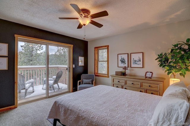carpeted bedroom with access to outside, multiple windows, a textured ceiling, and ceiling fan