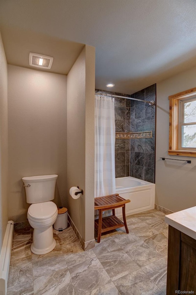 bathroom featuring a baseboard radiator, toilet, shower / bath combo with shower curtain, baseboards, and vanity