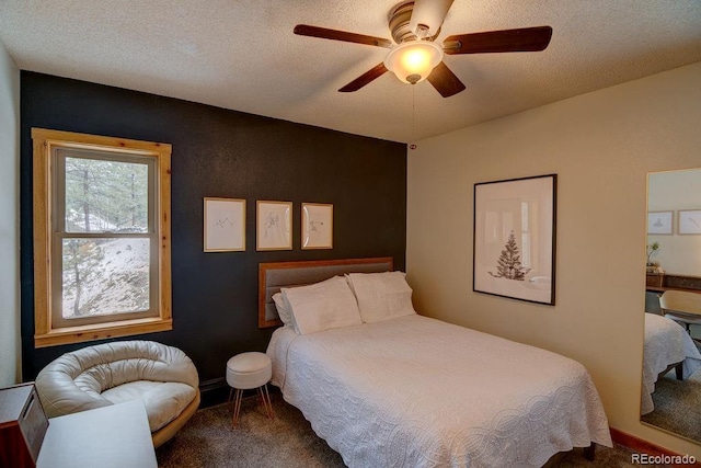bedroom featuring carpet floors, a ceiling fan, and baseboards