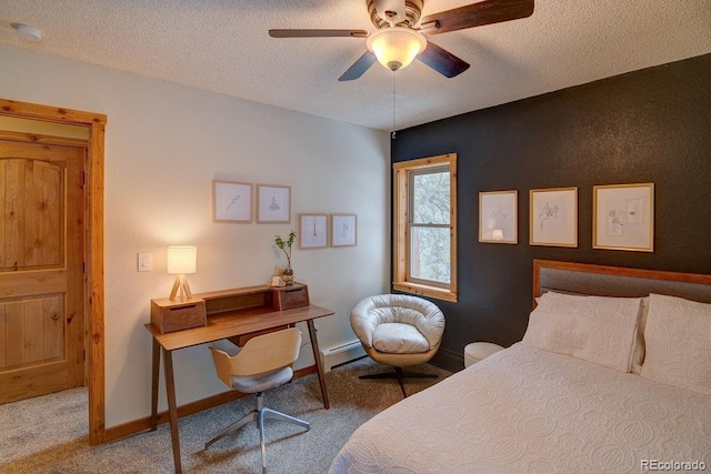 bedroom featuring carpet flooring, a textured ceiling, baseboard heating, baseboards, and ceiling fan