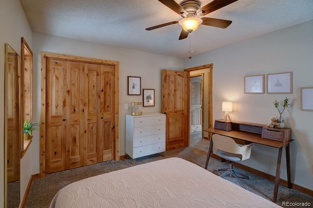 bedroom featuring dark carpet, baseboards, and a ceiling fan