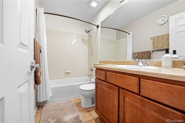 full bathroom with tile patterned flooring, shower / tub combo, vanity, and toilet