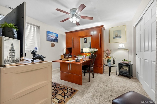 office with ceiling fan and light colored carpet