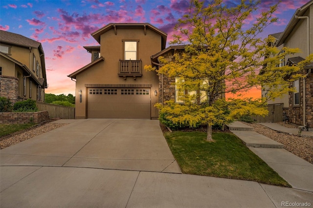 10705 Pinewalk Way, Highlands Ranch, CO 80130 - view of front facade with stucco siding, a garage, a balcony, and driveway