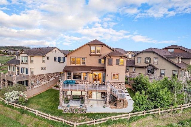 10705 Pinewalk Way, Highlands Ranch, CO 80130 - back of house with a patio, stucco siding, a residential view, stairway, and a deck