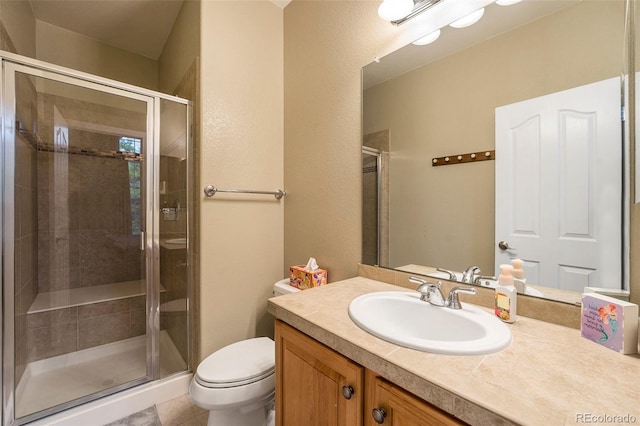 10705 Pinewalk Way, Highlands Ranch, CO 80130 - bathroom with toilet, vanity, a stall shower, and tile patterned flooring