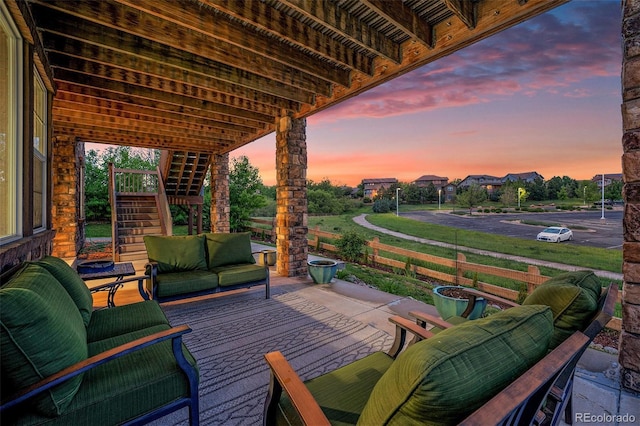10705 Pinewalk Way, Highlands Ranch, CO 80130 - deck at dusk featuring stairs and an outdoor hangout area