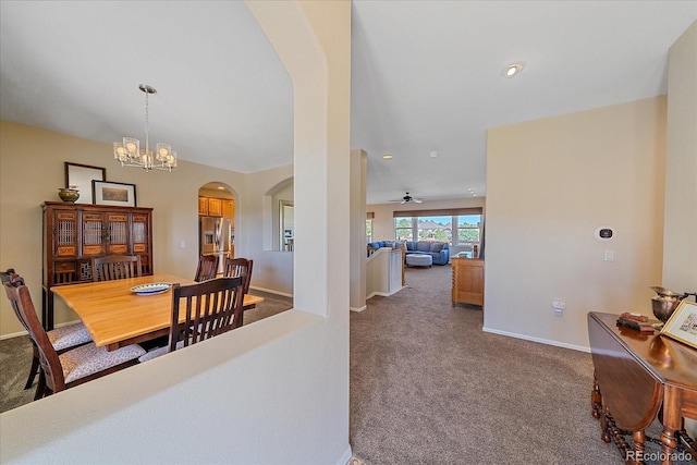 23425 E Otero Dr, Aurora, CO 80016 - dining room featuring arched walkways, carpet floors, a chandelier, a ceiling fan, and recessed lighting