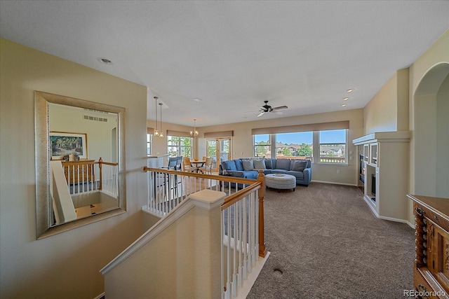 23425 E Otero Dr, Aurora, CO 80016 - hall with healthy amount of natural light, an upstairs landing, and carpet floors