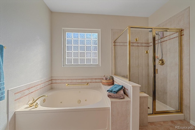 23425 E Otero Dr, Aurora, CO 80016 - full bath featuring a jetted tub, a shower stall, and tile patterned floors