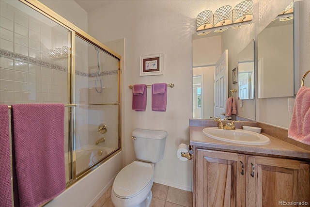 23425 E Otero Dr, Aurora, CO 80016 - bathroom featuring tile patterned floors, vanity, and enclosed tub / shower combo