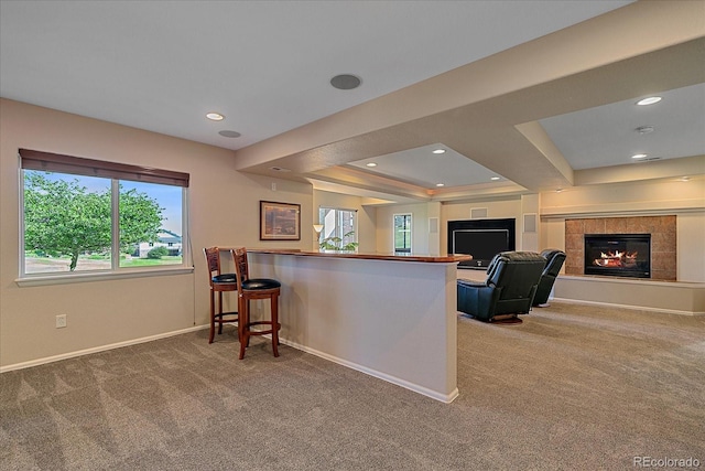 23425 E Otero Dr, Aurora, CO 80016 - living room with carpet flooring, plenty of natural light, a tiled fireplace, recessed lighting, and a tray ceiling