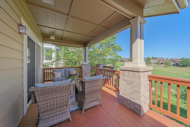 23425 E Otero Dr, Aurora, CO 80016 - wooden terrace with a lawn and an outdoor living space