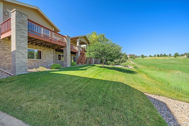 23425 E Otero Dr, Aurora, CO 80016 - view of grassy yard featuring a wooden deck and stairs