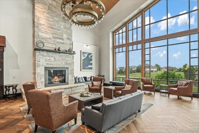 23425 E Otero Dr, Aurora, CO 80016 - living room featuring a high ceiling and a stone fireplace