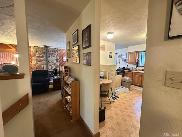 33691 Nova Rd, Pine, CO 80470 - corridor featuring a textured ceiling and baseboards