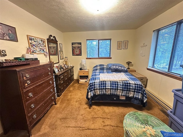 33691 Nova Rd, Pine, CO 80470 - carpeted bedroom featuring multiple windows, a baseboard heating unit, and a textured ceiling