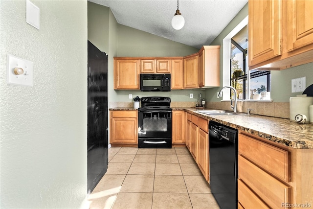 kitchen featuring hanging light fixtures, light tile patterned floors, black appliances, lofted ceiling, and sink