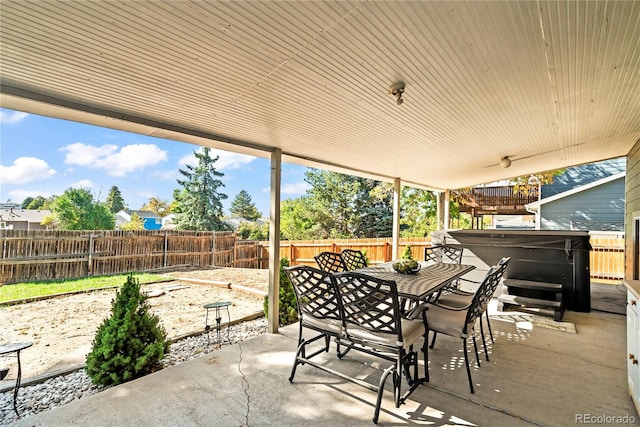 view of patio with a hot tub